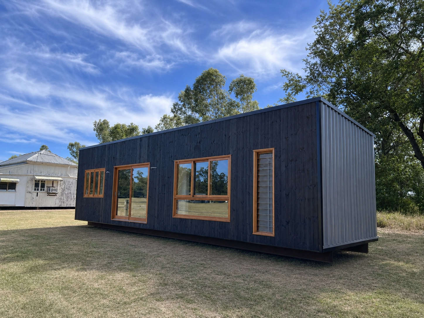 The Forge 12 — Shou Sugi Ban charred-timber modular home, front elevation